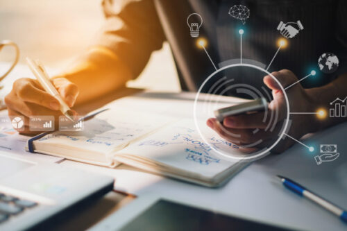 Hand holding calculator next to some figures | DSCR Financing To Expand your Customers Investment Portfolio | DG Pinnacle TPO - Miami Wholesale Mortgage Funding Lender