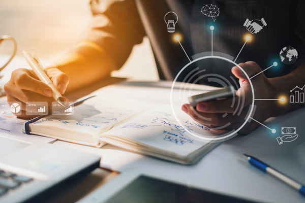 Hand holding calculator next to some figures | DSCR Financing To Expand your Customers Investment Portfolio | DG Pinnacle TPO - Miami Wholesale Mortgage Funding Lender