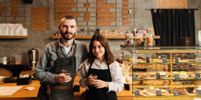 Young couple of independent workers in their own coffee-shop | Mortgage Loans Your Self-Employed Customers | DG Pinnacle TPO - Miami Wholesale Mortgage