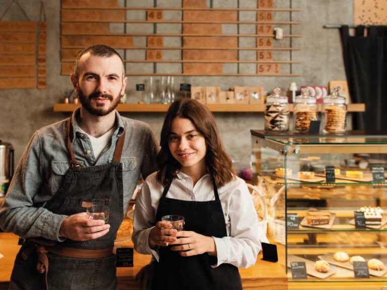Young couple of independent workers in their own coffee-shop | Mortgage Loans Your Self-Employed Customers | DG Pinnacle TPO - Miami Wholesale Mortgage