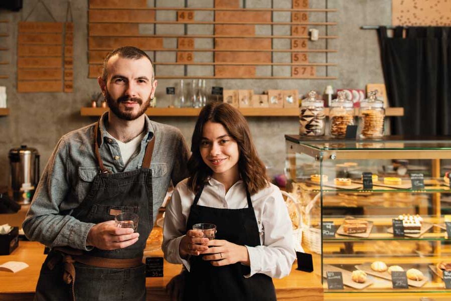 Young couple of independent workers in their own coffee-shop | Mortgage Loans Your Self-Employed Customers | DG Pinnacle TPO - Miami Wholesale Mortgage