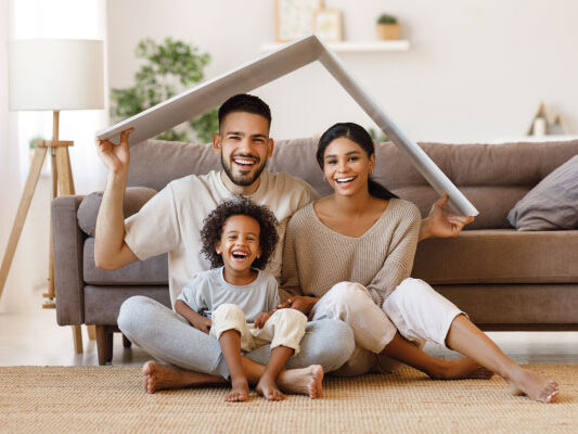 Happy couple with their kid under roof - Conventional Mortgage Loans | DG Pinnacle TPO - Wholesale Division | Miami Mortgage Lender