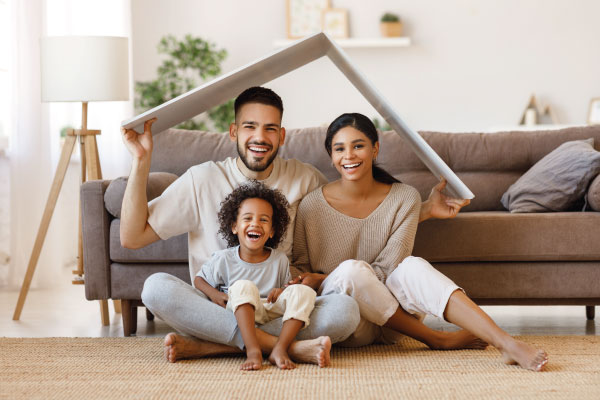 Happy couple with their kid under roof - Conventional Mortgage Loans | DG Pinnacle TPO - Wholesale Division | Miami Mortgage Lender