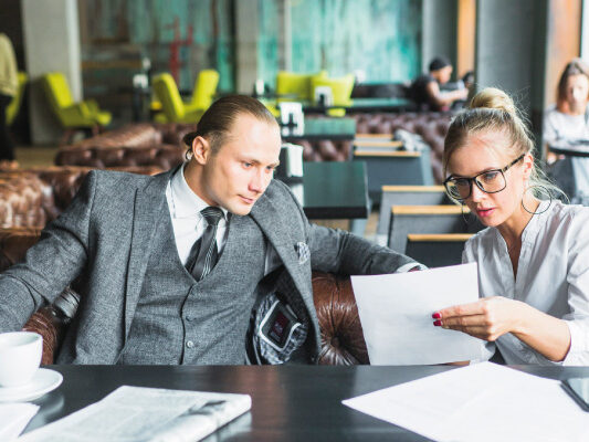 Young man and woman closing business deals in a restaurant - Non-QM DSCR Mortgage Loans | DG Pinnacle TPO - Wholesale Division | Miami Mortgage Lender