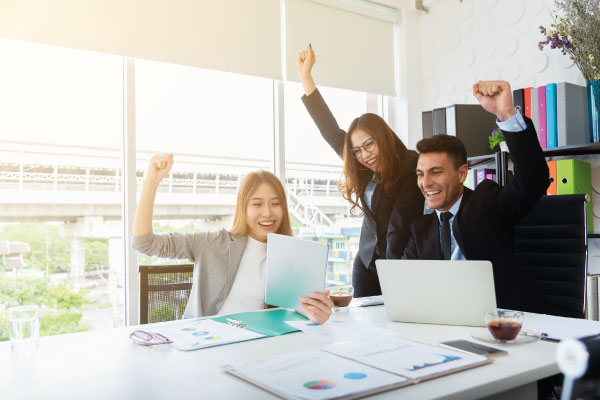 Office team celebrating together | 5 Ways to Avoid Burnout as a Loan Officer | DG Pinnacle TPO - Wholesale Division | Miami Mortgage Lender