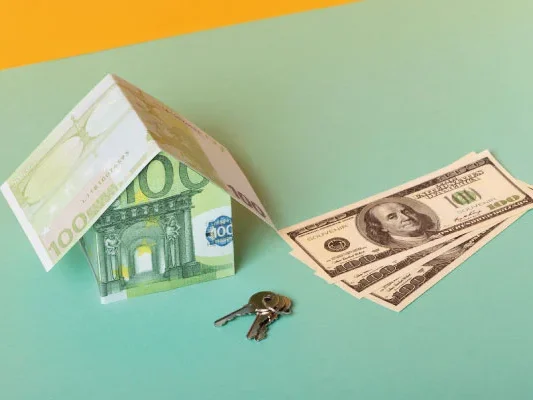 Model house with made with dollar bills next to a pair of keys | 5 money tips to share with your borrowers | DG Pinnacle TPO - Miami Wholesale Mortgage Funding Lender