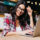 Beautiful freelancer woman smiling next to her laptop | DG Pinnacle TPO - Miami Wholesale Mortgage Funding Lender